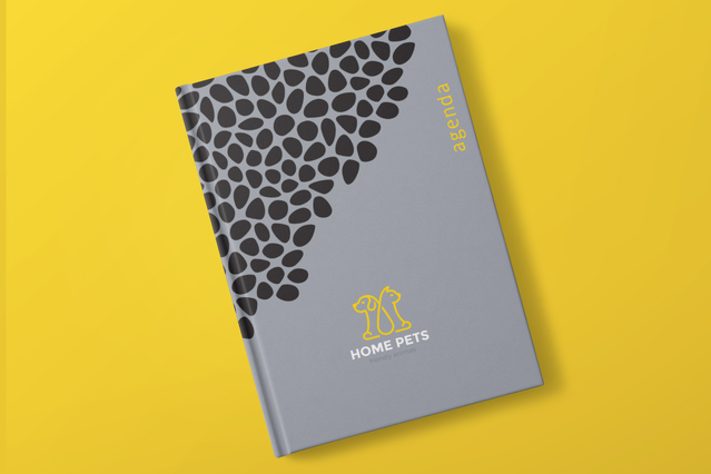 Agenda cartonne hebdomadaire gris motif galets noirs logo Home Pets jaune. 128 pages 3 formats Sprint24.