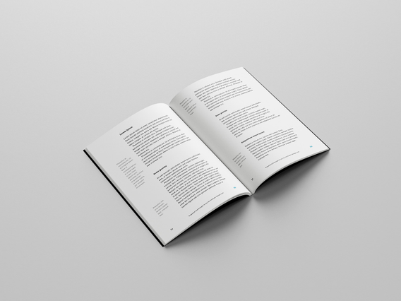 Catalogue imprime ouvert pages interieures blanches colonnes texte. Catalogue ouvert pages interieures blanches colonnes texte structurees typographie minimale. Sprint24.